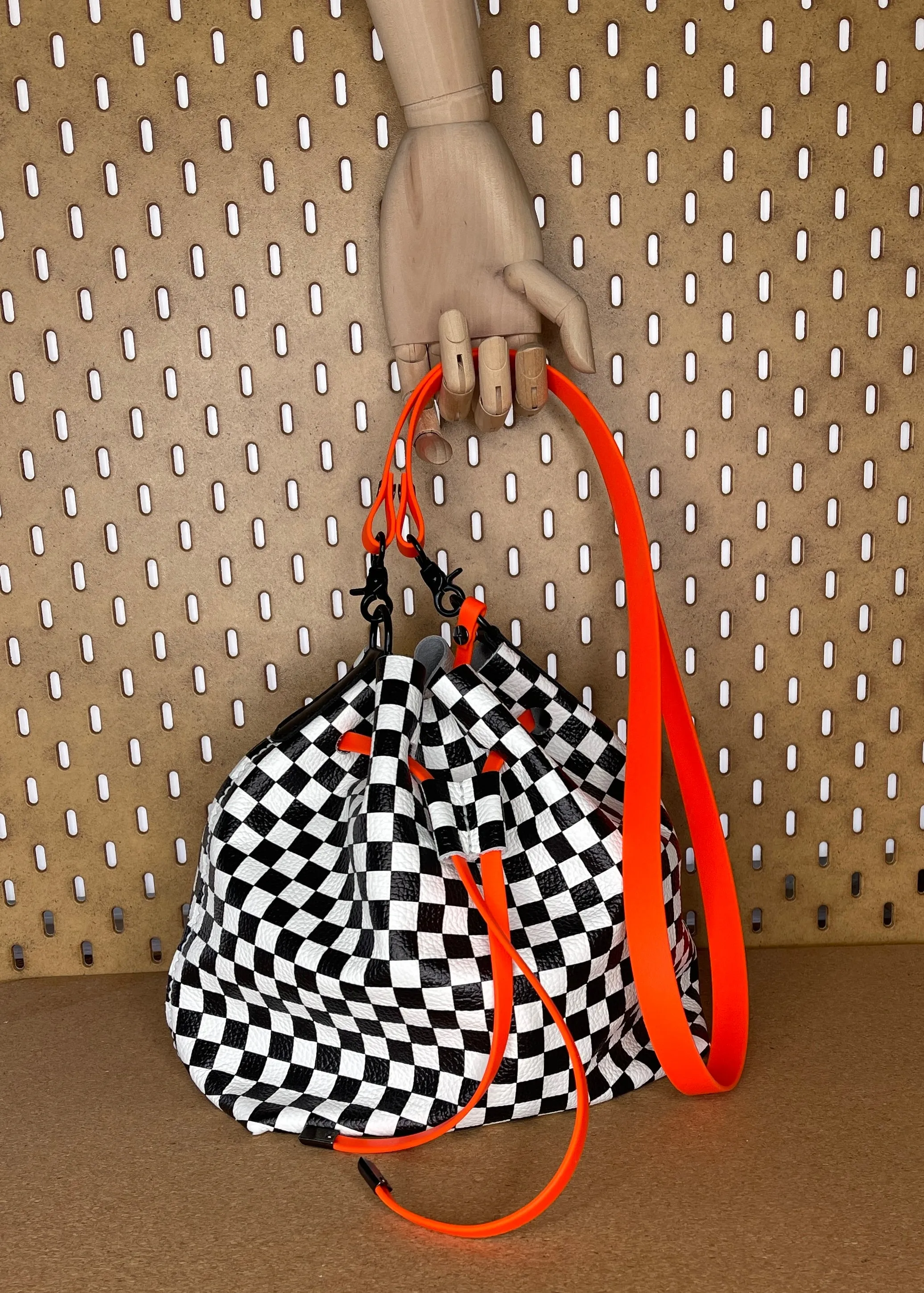 Checkerboard Leather and Neon Orange Drawstring Crossbody Bucket Bag