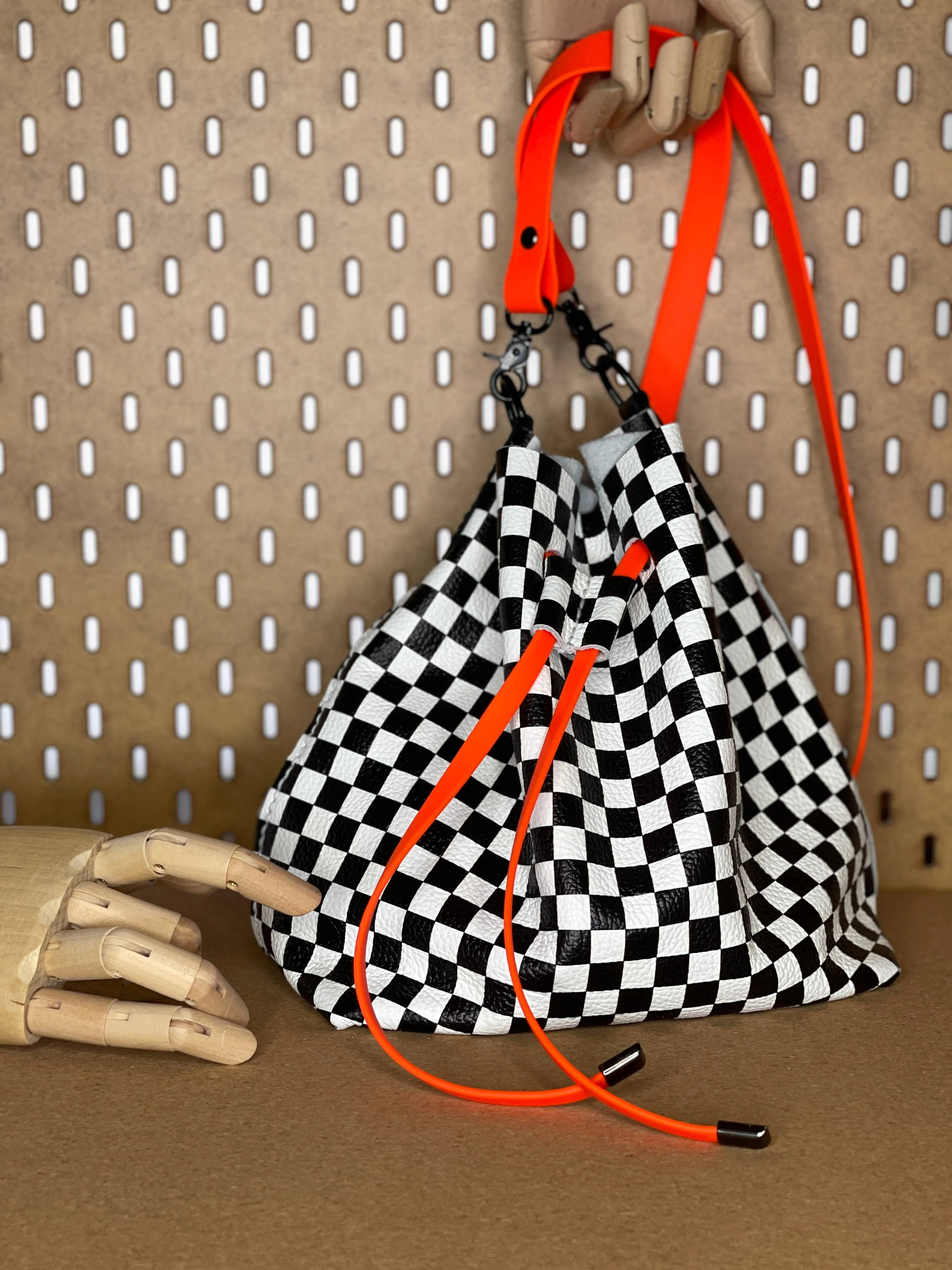 Checkerboard Leather and Neon Orange Drawstring Crossbody Bucket Bag