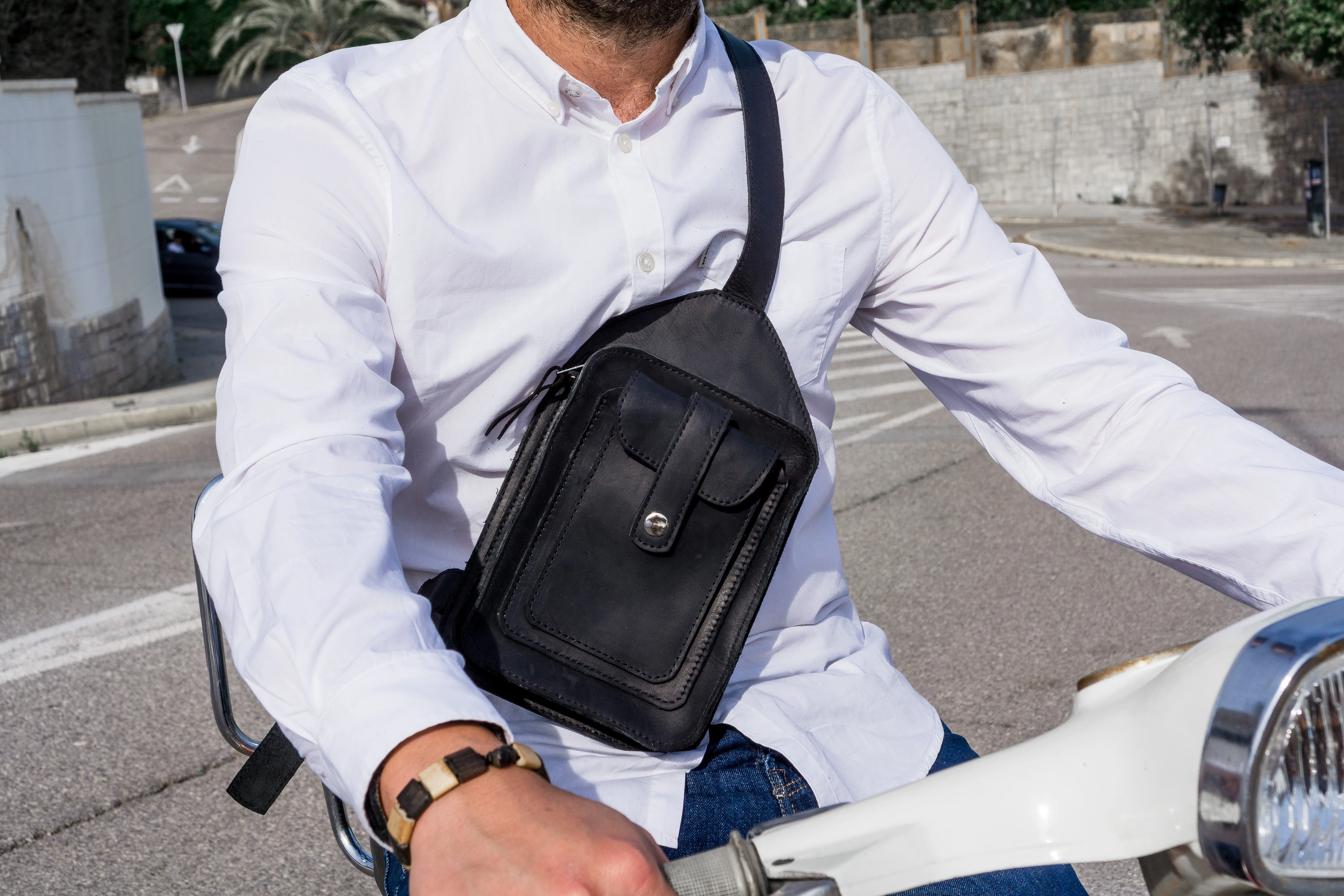 Men's crossbody bag featuring black leather and multiple pockets, Handcrafted