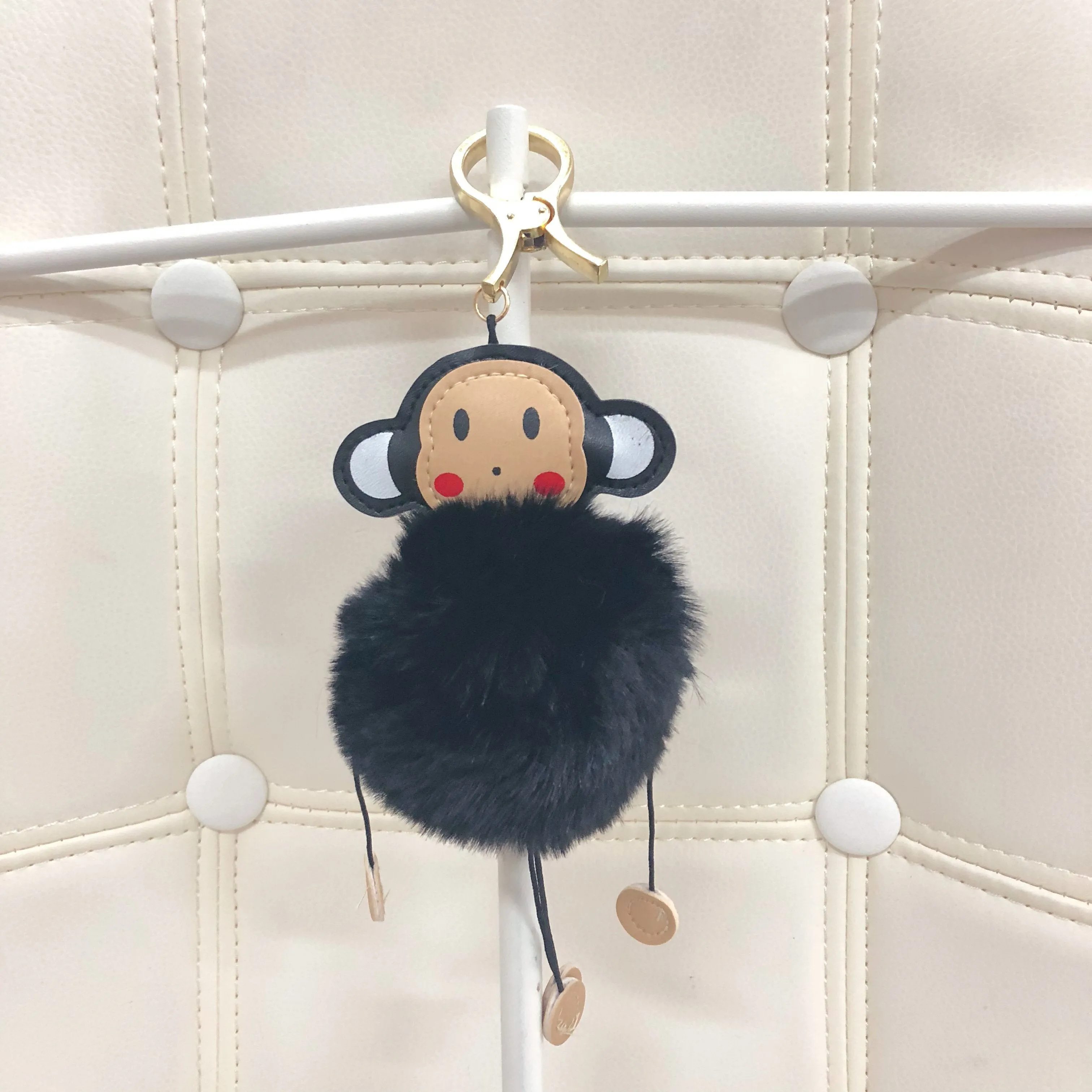 Monkey with fur ball bag charm