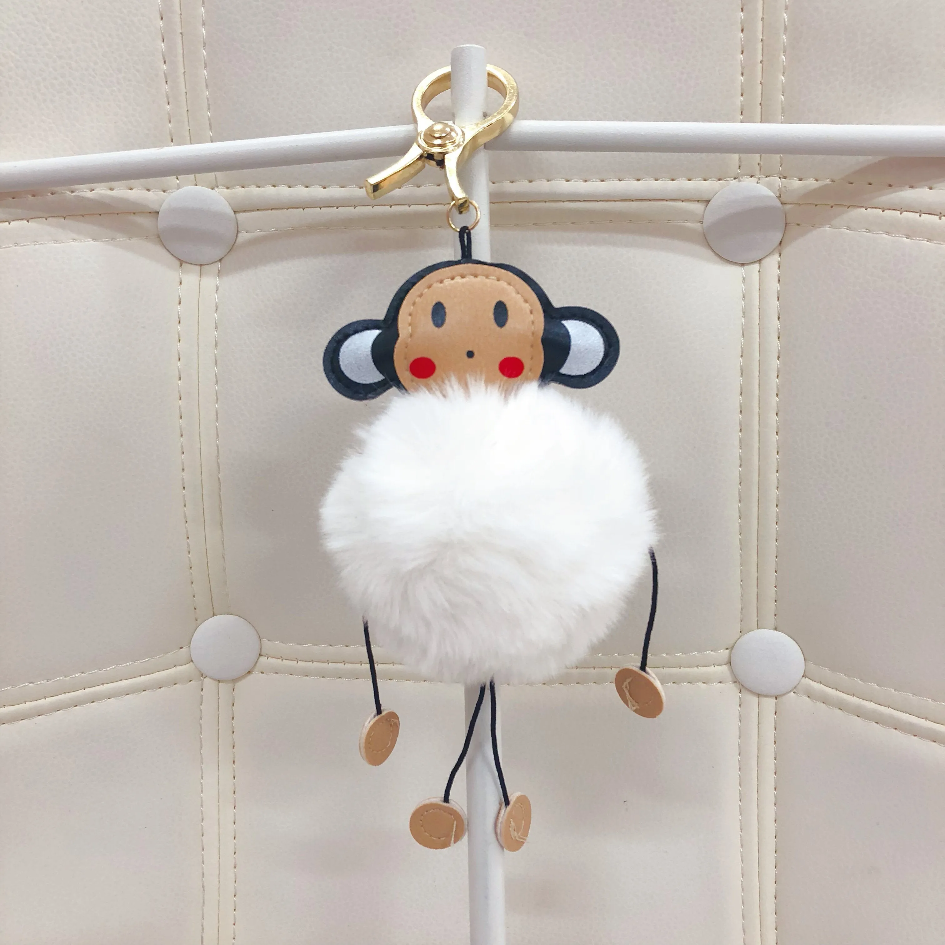 Monkey with fur ball bag charm